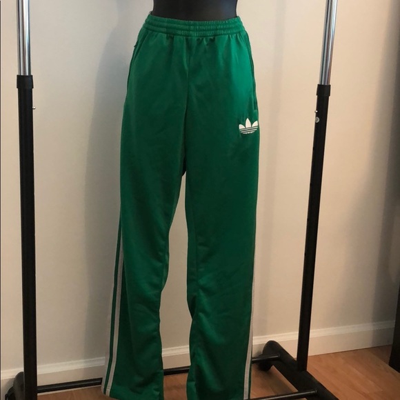 green and white adidas track pants